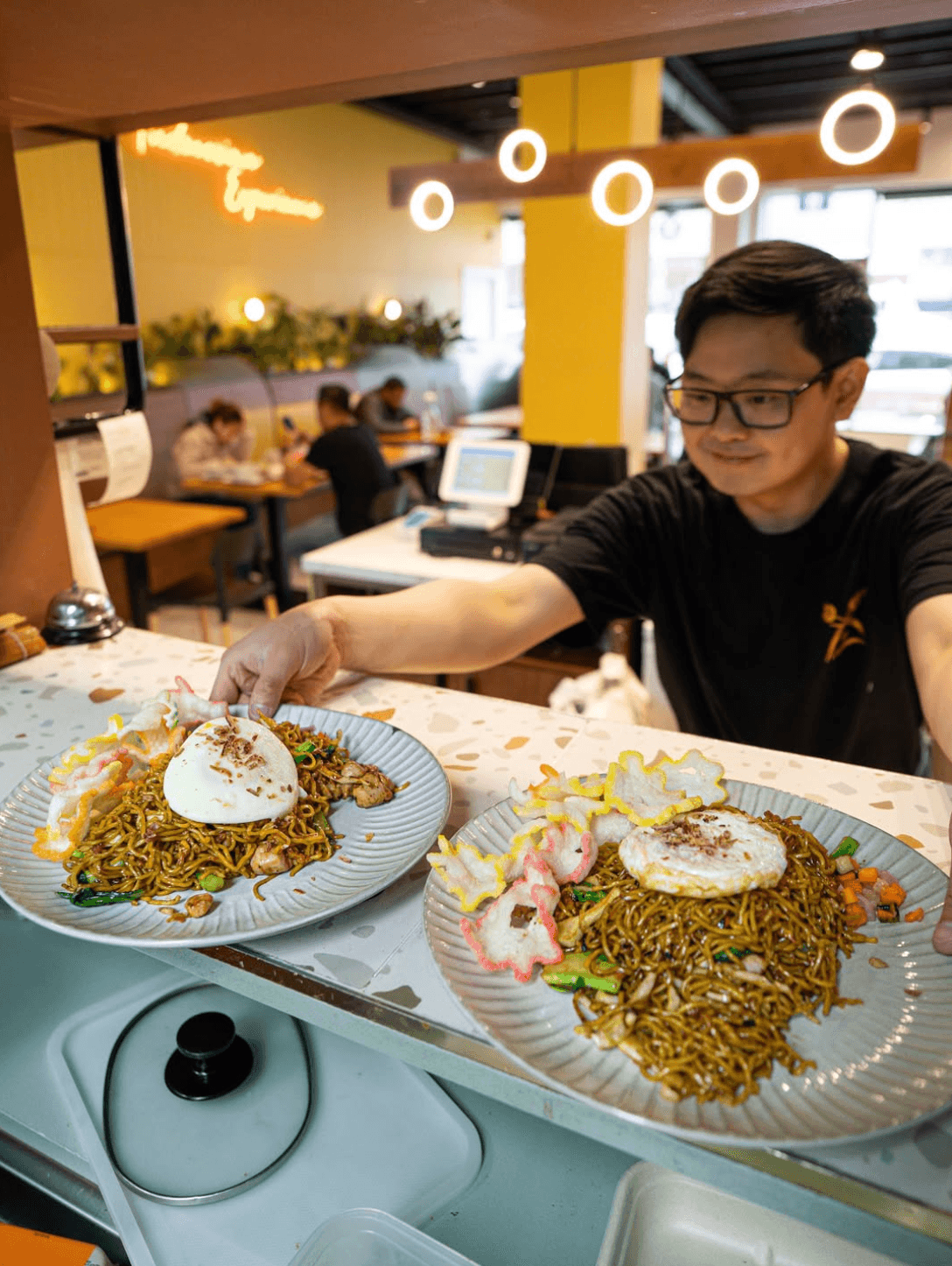 Pondok Nasi Bakar staff serving authentic halal Indonesian food with warm hospitality at catering events